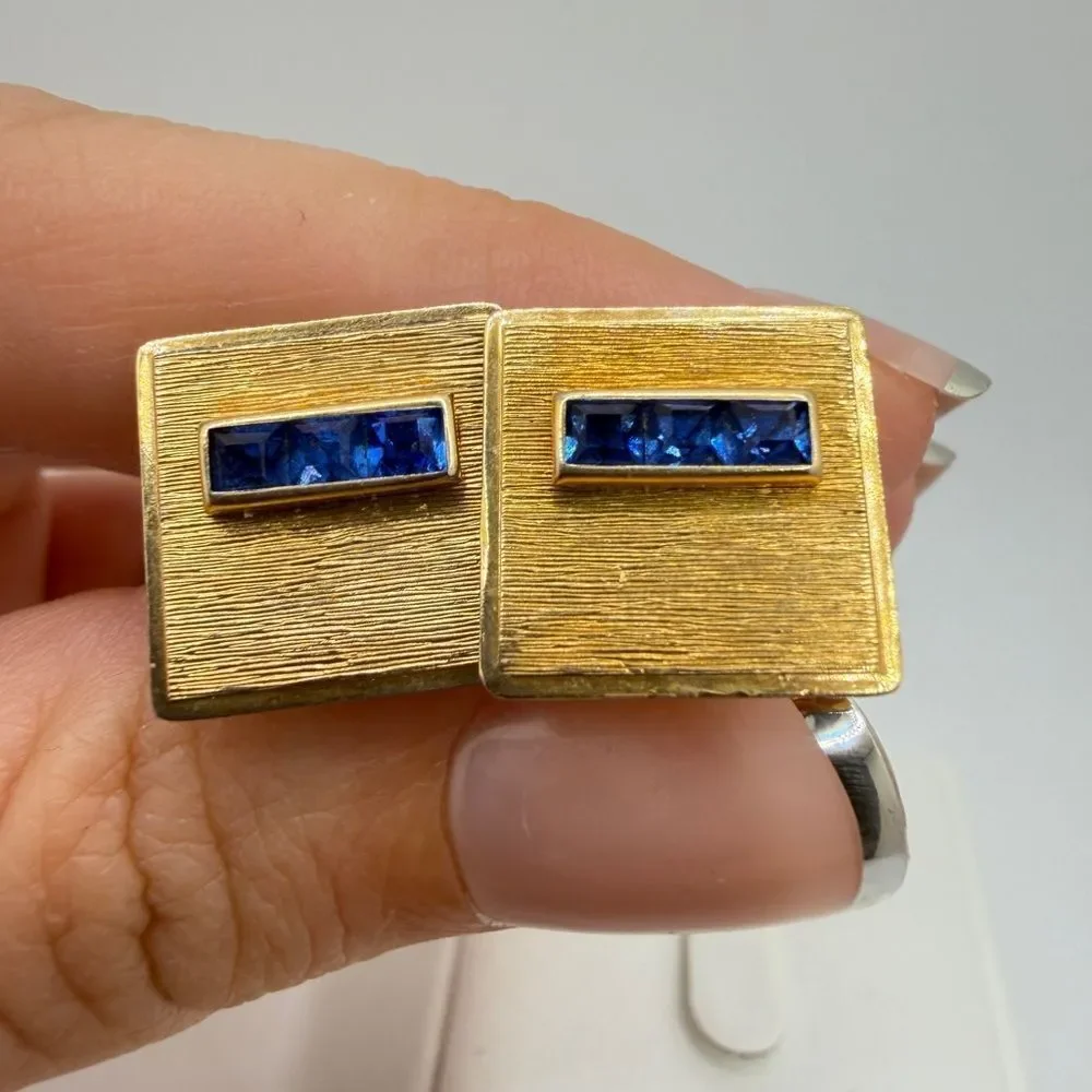 Vintage Krementz Gold tone cuff likes with princess cut blue rhinestone accents!